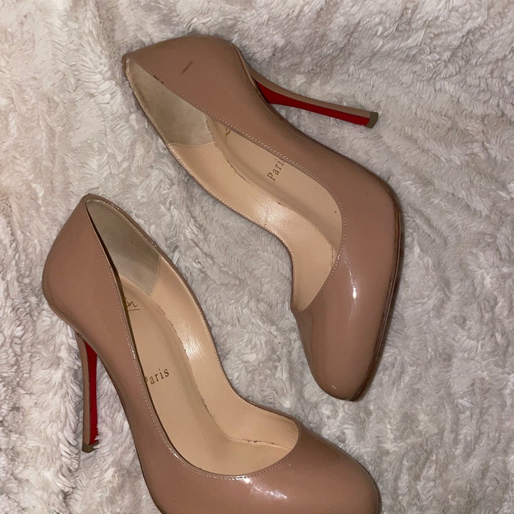 Christian Louboutin
Dolly Patent Red Sole Pumps